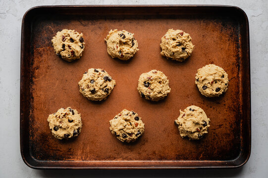 Top view of sheet pan of chocolate chip cookie dough ready to bake.