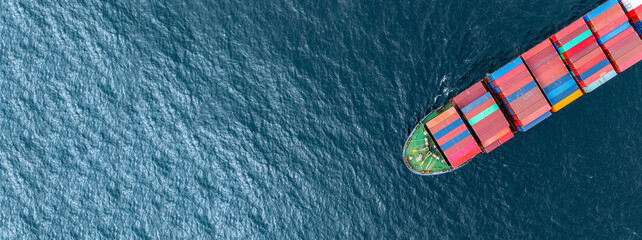Aerial view container ship cargo shipping business logistic import and export freight transportation by container ship in open sea, Container loading cargo freight ship boat. © Kalyakan