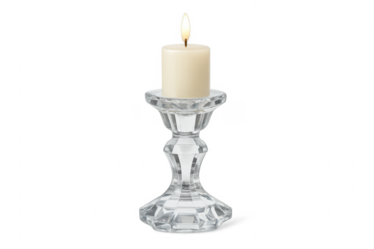 Burning pillar candle in glass candlestick and transparent background