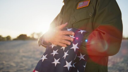 Veteran Soldier Caressing The USA Flag - Powered by Adobe