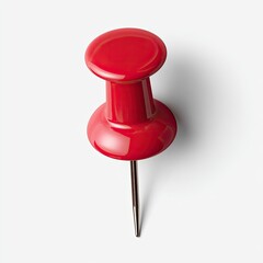 High-angle close-up of a bright red pushpin.  A glossy, round head sits atop a tapered shaft, ending in a sharp metal point.  The pin is centered against a plain white background