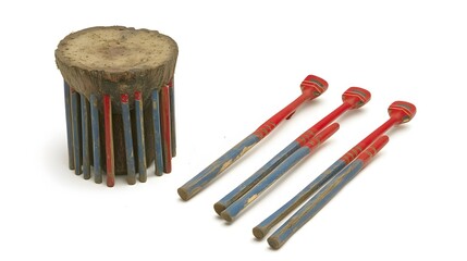 Native american dice game with wooden sticks and log block in a row