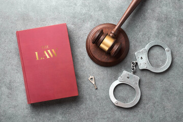 A judge gavel, handcuffs and 