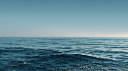 Fototapeta premium Calm Ocean Surface with Clear Sky and Serene Water Reflection