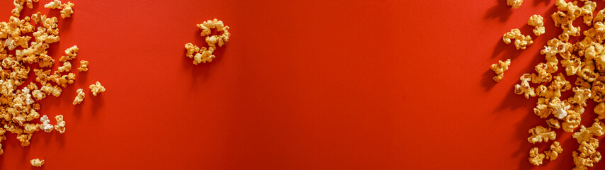 Popcorn on a vibrant red background with copy space