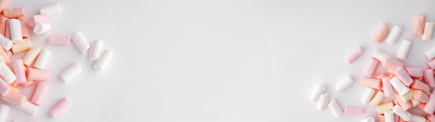 Marshmallows on a white background, perfect for website headers.