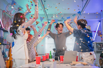 Excited office team celebrates incredible profit growth and victory results announcement together,...