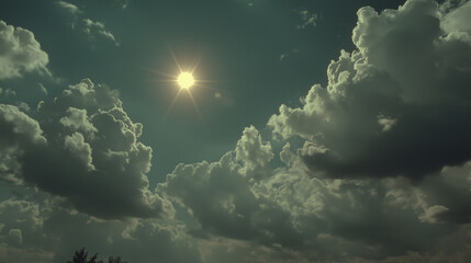 Bright sun in a clear sky above fluffy clouds; a calm, atmospheric landscape with a teal-blue hue and a lens flare effect.