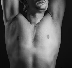 Cropped image of shirtless fit male body in underwater