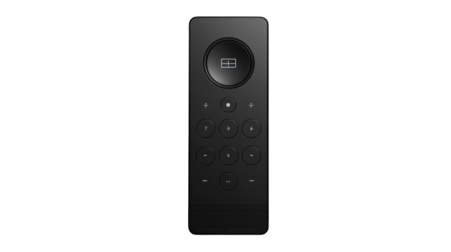 Black remote control with number buttons on a dark background