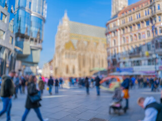 Crowd of anonymous people walking on busy city street