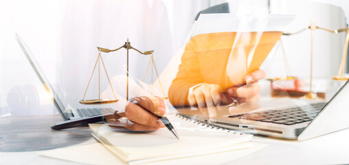 Business and lawyers discussing contract papers with brass scale on desk in office. Law, legal services, advice, justice and law concept picture with film grain effect