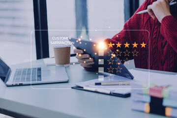 close up Man hand using computer Notebook with popup five star icon for feedback review satisfaction service, Customer service experience and business satisfaction survey.