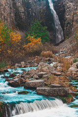 Autumn at Njupeskär, Sweden's largest waterfall showcases vibrant colors and flowing waters