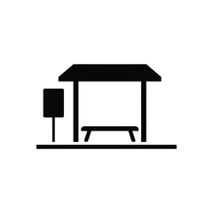Simple black and white icon of a bus stop shelter with bench