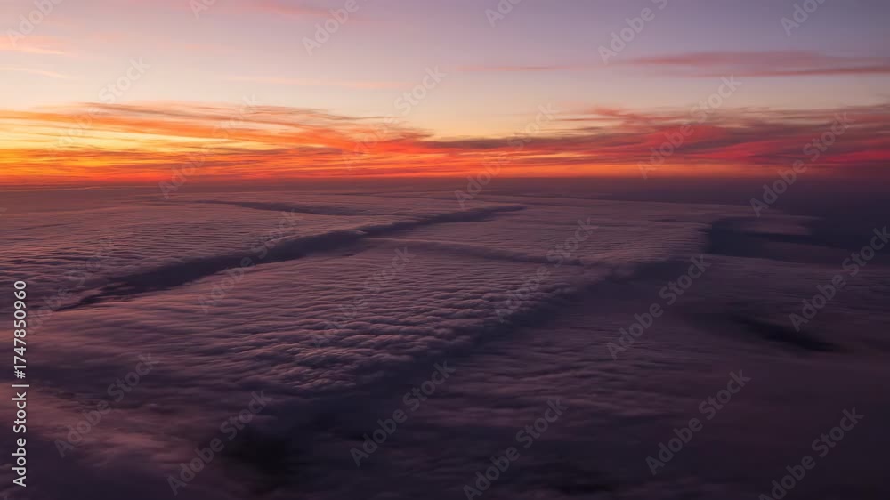 Wall mural dynamic cloud patterns form a mesmerizing grid across the sky during a beautiful sunset timelapse pu