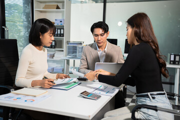 Business team working and studying together with tablet document graph paper in office, discuss finance and marketing solution reporting file in working place.