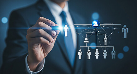 Businessman drawing organization chart with digital pen on virtual interface display showing hierarchy and team structure for business planning and management