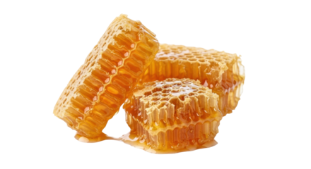 Isolated chunks of fresh honeycomb with honey dripping, sweet and delicious food item