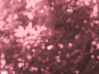 Bokeh blur from trees in pink tones for abstract nature background.    