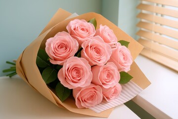 Pink roses bouquet elegantly rests on a sunlit windowsill, wrapped in rustic craft paper, offering a gentle, romantic bloom for home decor