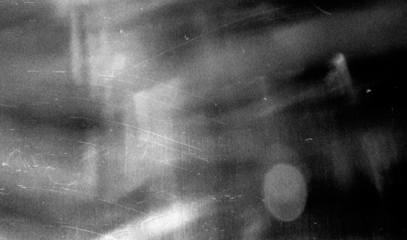 Stippled grain texture background. Black sprayed dots gradient wallpaper. Rough noisy sand dotted backdrop.