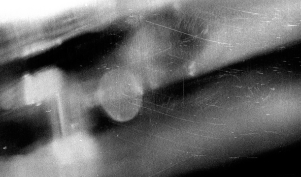 Stippled grain texture background. Black sprayed dots gradient wallpaper. Rough noisy sand dotted backdrop.