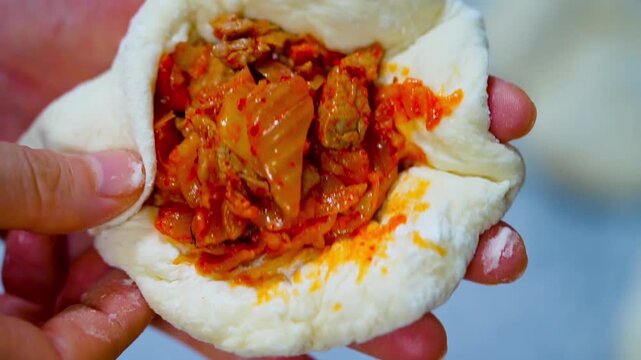 Pyanse, pigodi or Wangmandu steamed pie, dumpling stuffed with kimchi and meat
