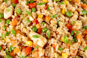 Fried rice with chicken and vegetables. Close up. Asian food.