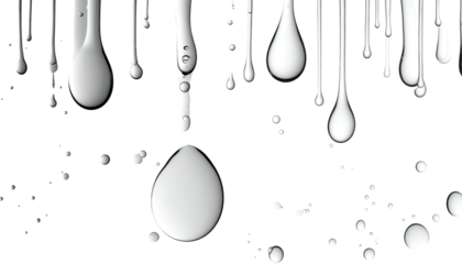 White liquid droplets and drips against a black background