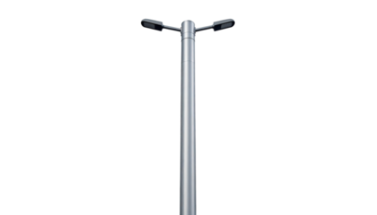 A tall, metallic street light, two-headed, against a solid black background