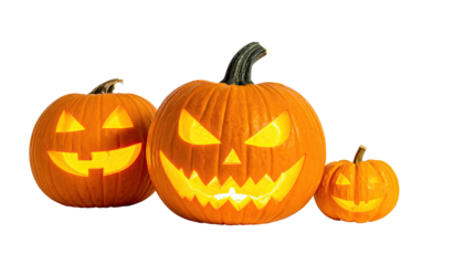 Three carved, illuminated pumpkins of varying sizes, against a black background