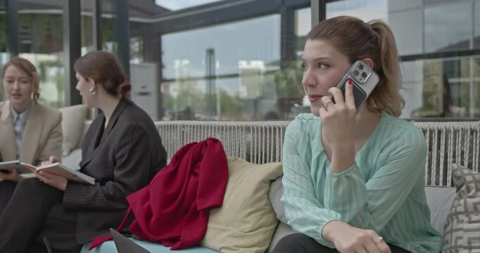 Dynamic team meeting in a modern business district, showcasing collaboration and effective communication. - Powered by Adobe