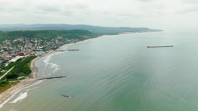 High aerial perspective of the town of puerto colombia showing the caribbean sea coastline, beaches an harbour
