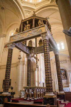 Main altar centered with columns and baldachin with statues representing biblical figures in the Ta' Pinu Basilica, Gharb - Gozo MALTA