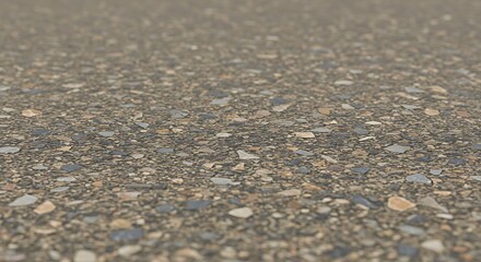 Close-up view of textured asphalt road surface with embedded stones and gravel details