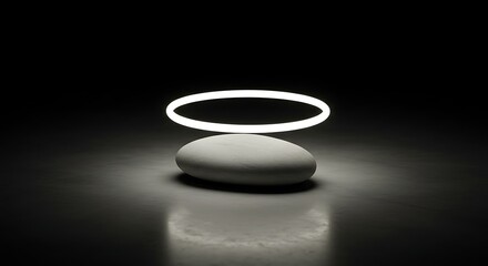 Ethereal glowing ring hovers above a smooth, balanced stone, creating a mystical aura in the dark
