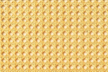 A closeup of a woven cane pattern, showcasing the intricate texture and natural color of the material, ideal for backgrounds and design elements with a rustic touch