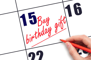15 th day of the month. Hand writing Buy birthday gift reminder and drawing a line on calendar with red pen on white background. Concept of family reminder. Planning and scheduling