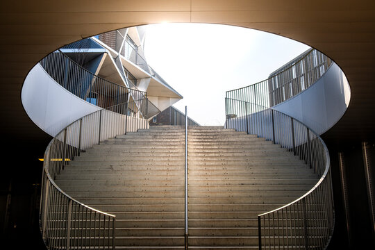 In Copenhagen, Denmark, circular staircase meets skylight, with light composition and geometry, revealing rhythm within Denmark, as structure and modern design shape proportion and Copenhage