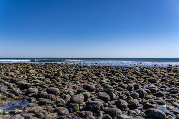 Alluvial gravel, sand and clay of flood plains. Malibu Lagoon State Beach, Malibu is a beach city in the Santa Monica Mountains region of Los Angeles County, California. pebble