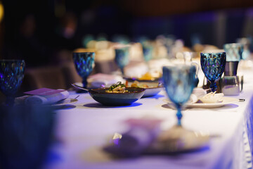 Elegant dinner table set for a special occasion with gourmet dishes
