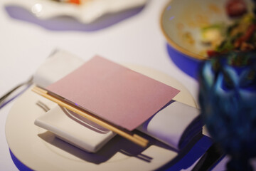 Elegant table setting with chopsticks and decorative card at fine dining
