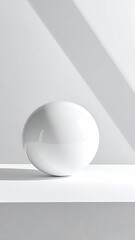 Glossy white sphere on white surface, strong light pattern