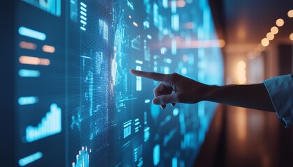 A professional's hand interacts with a large, futuristic touchscreen displaying complex data visualizations and analytics.
