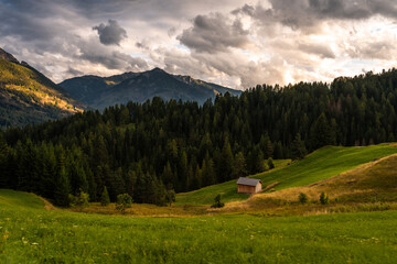 Scenic Mountain Landscape in the Dolomites, Italy.
Alpine Meadow with Peaks and mountain hut and pasture
