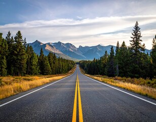 Naklejka premium Mountain road stretches to horizon. Sky is blue & cloudy