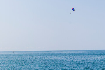 Shot of the person doing person doing parasailing activity. Outdoors