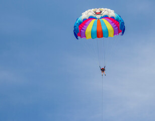 Shot of the person doing person doing parasailing activity. Outdoors