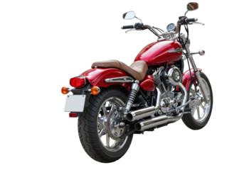 Isolated vintage red cruiser motorcycle from a low angle, showing retro chrome exhaust pipes